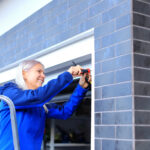 person fixing garage door