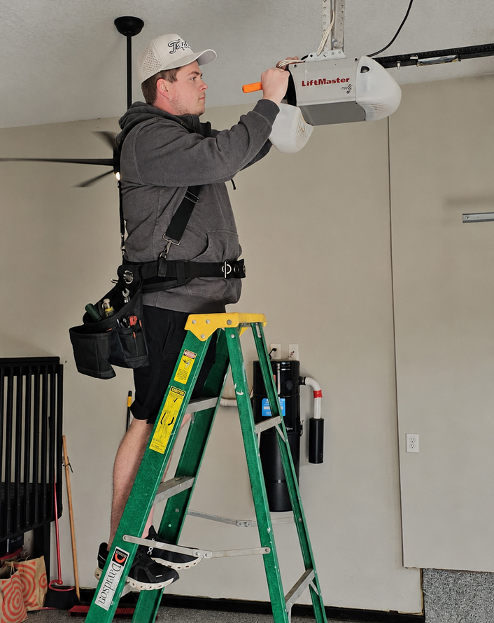 Matt from Topline Garage Doors fixing a garage door opener